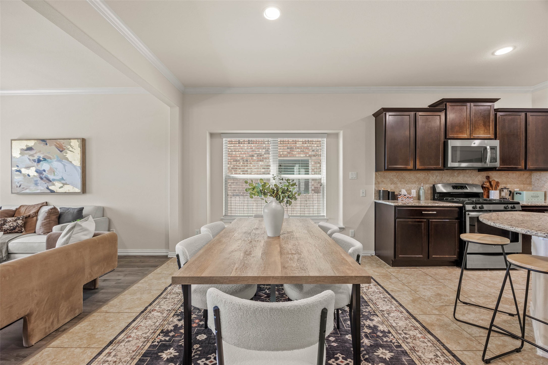 536 Rancho Verde Drive Leander, TX 78641 - Photo 7 of 37 a living room with stainless steel appliances furniture a dining table and kitchen view