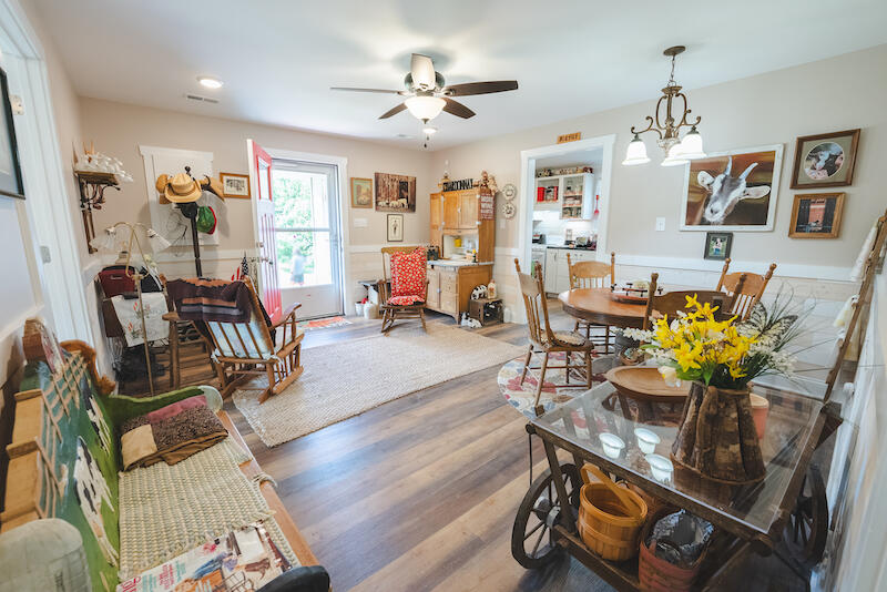 2598 Lone Ivy Road Stuart, VA 24171 - Photo 19 of 26 a dining room filled chandelier and wooden floor