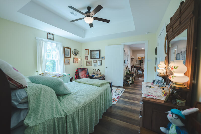 2598 Lone Ivy Road Stuart, VA 24171 - Photo 25 of 26 a living room with furniture and a chandelier