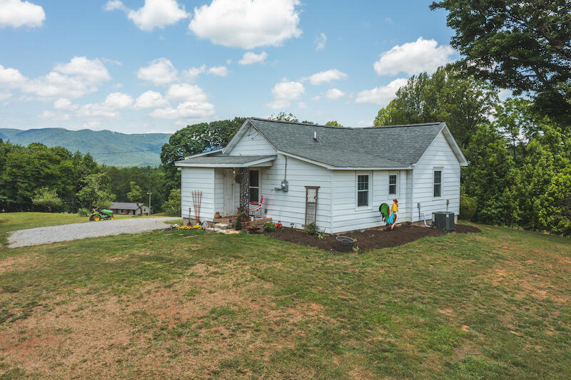 2598 Lone Ivy Road Stuart, VA 24171 - Photo 5 of 26 a view of a house with a yard and sitting area