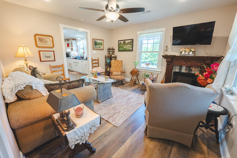 2598 Lone Ivy Road Stuart, VA 24171 - Photo 8 of 26 a living room with furniture a flat screen tv and a window