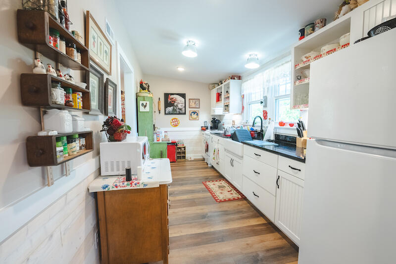 2598 Lone Ivy Road Stuart, VA 24171 - Photo 10 of 26 a kitchen with stainless steel appliances a white cabinets and wooden floor