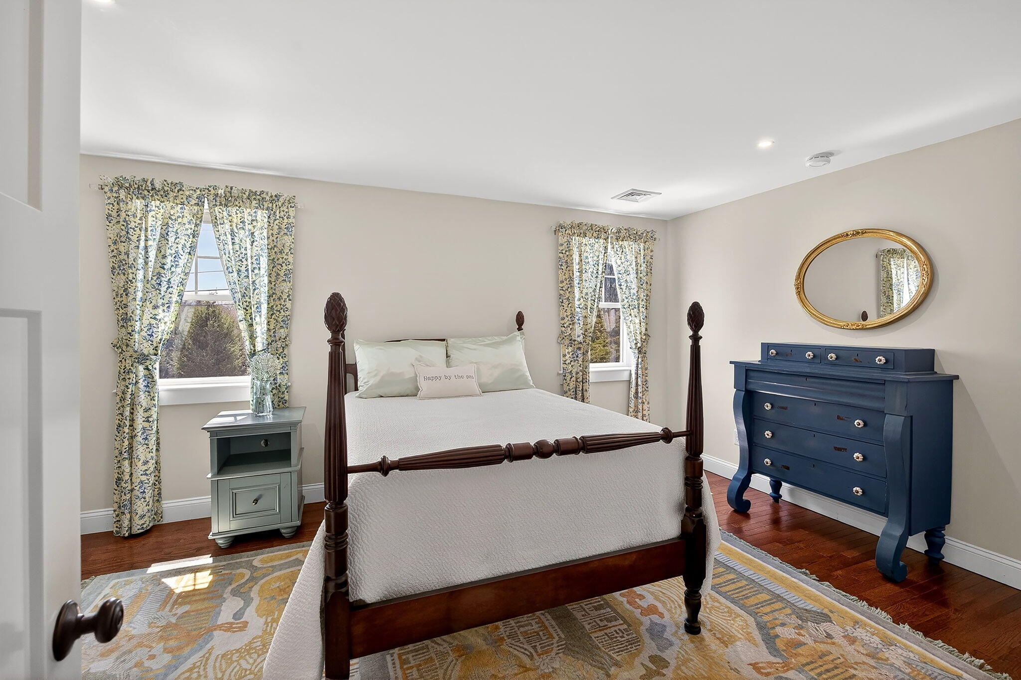 176 Bumps River Road Osterville, MA 02655 - Photo 33 of 54 a bedroom with a bed and wooden floor