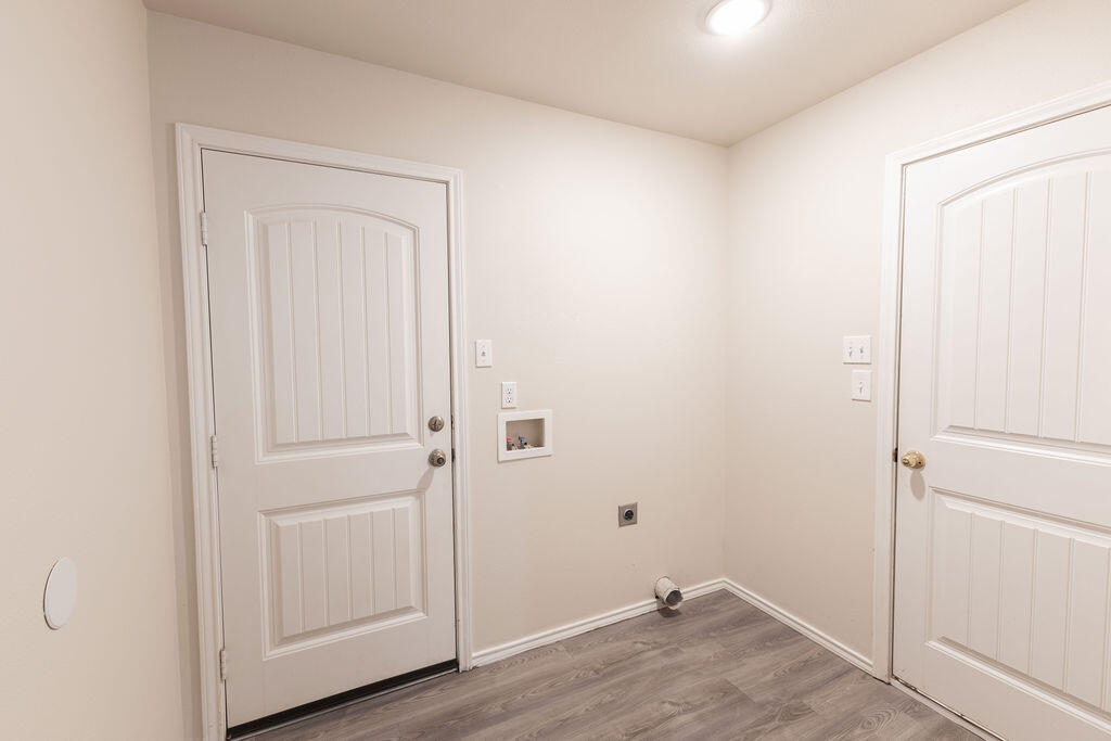 8907 Terrell Avenue Lubbock, TX 79423 - Photo 4 of 8 a view of a room with wooden floor
