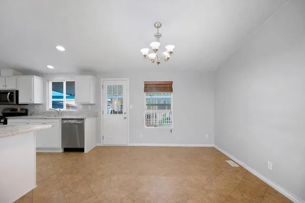 a view of a kitchen with a sink cabinets and window