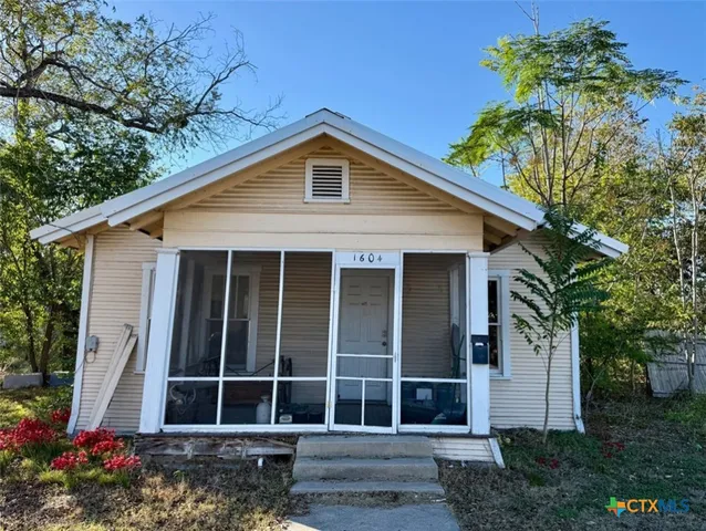 a house with a flower garden