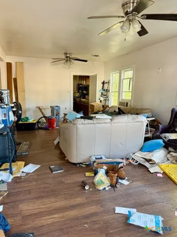 a room with table chairs and a chandelier
