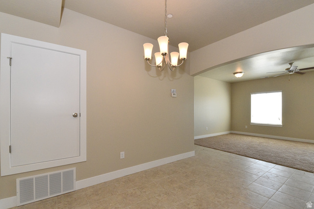 241 West Ridge Road Saratoga Springs, UT 84045 - Photo 9 of 21 Tile flooring in a neutral tone, featuring a five-light chandelier