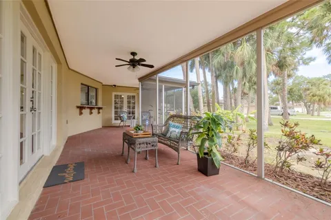 a living room filled with furniture and a large window