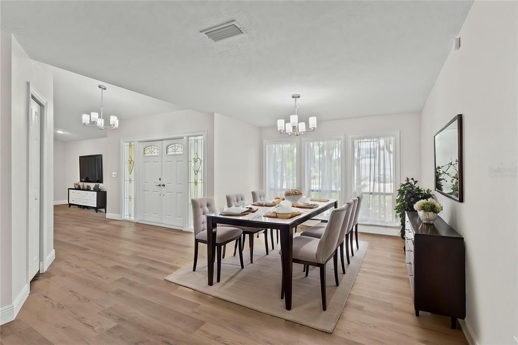 4415 Marine Parkway New Port Richey, FL 34652 - Photo 18 of 72 a view of a a dining room with furniture window and wooden floor