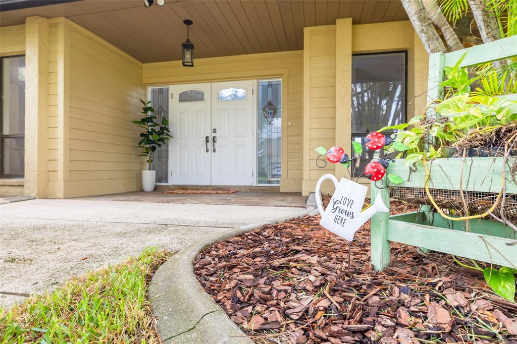 4415 Marine Parkway New Port Richey, FL 34652 - Photo 2 of 61 a front view of a house with garden