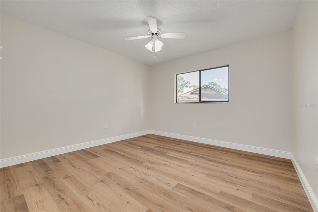 4415 Marine Parkway New Port Richey, FL 34652 - Photo 26 of 61 wooden floor in an empty room with a window