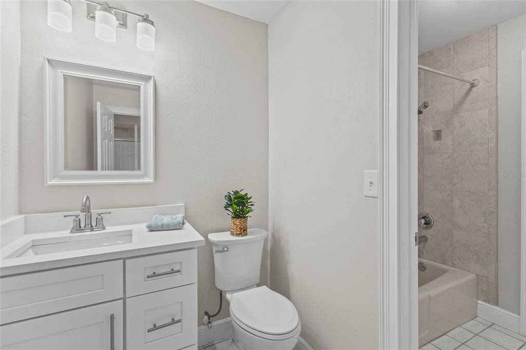 4415 Marine Parkway New Port Richey, FL 34652 - Photo 28 of 72 a bathroom with a sink a toilet and shower