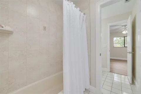 an empty room with a cabinet and mirrors