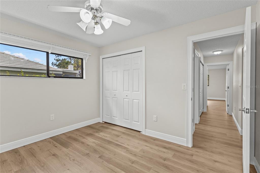 4415 Marine Parkway New Port Richey, FL 34652 - Photo 31 of 72 a view of an empty room with wooden floor