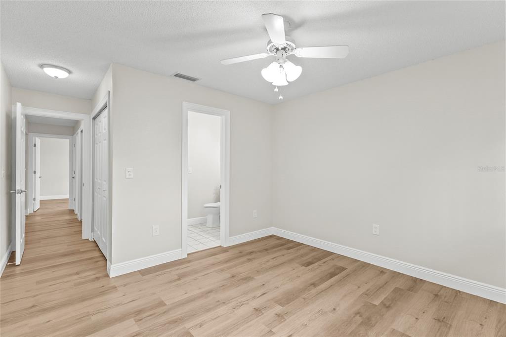 4415 Marine Parkway New Port Richey, FL 34652 - Photo 33 of 72 a view of an empty room with wooden floor