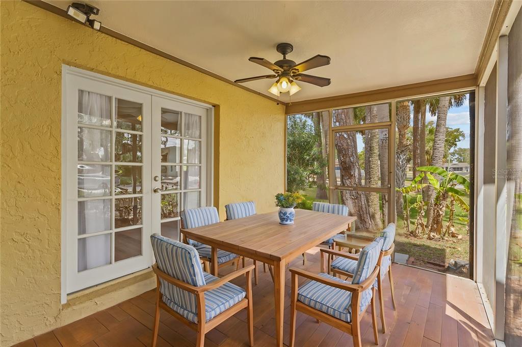 4415 Marine Parkway New Port Richey, FL 34652 - Photo 40 of 72 a view of a dining room with furniture window and wooden floor