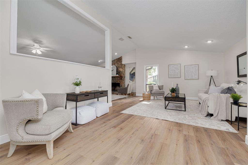 4415 Marine Parkway New Port Richey, FL 34652 - Photo 4 of 61 a living room with furniture and a wooden floor