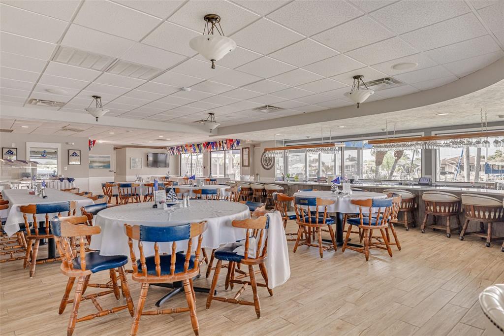 4415 Marine Parkway New Port Richey, FL 34652 - Photo 42 of 61 a view of a dining room with furniture window and outside view