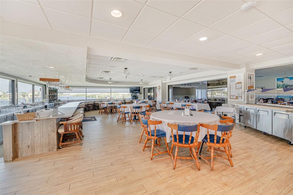 4415 Marine Parkway New Port Richey, FL 34652 - Photo 43 of 61 a large dining space with lots of furniture and view living room