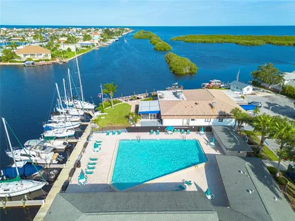 a front view of a building with palm trees