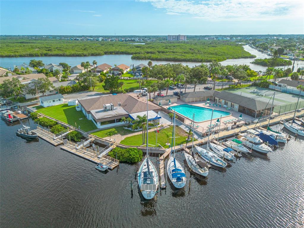 4415 Marine Parkway New Port Richey, FL 34652 - Photo 52 of 72 an aerial view of a swimming pool with lawn chairs