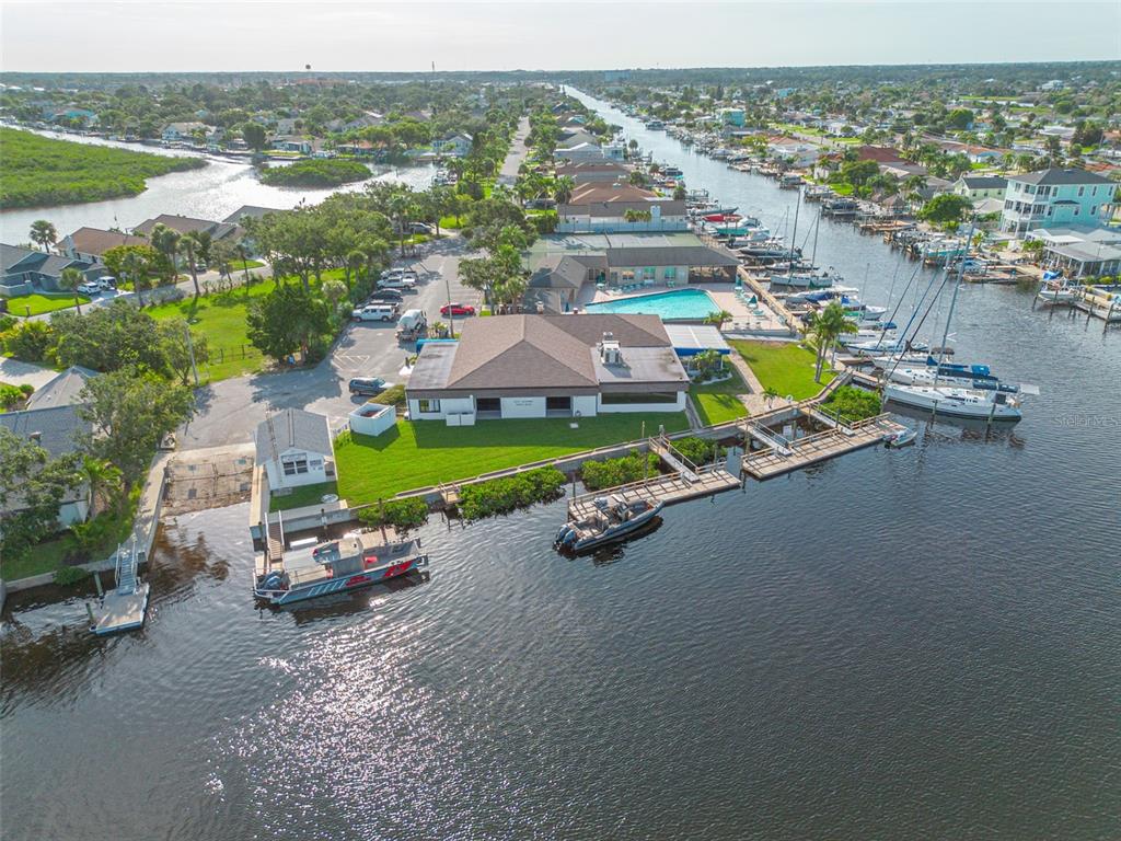 4415 Marine Parkway New Port Richey, FL 34652 - Photo 55 of 72 an aerial view of a house with a garden and lake view