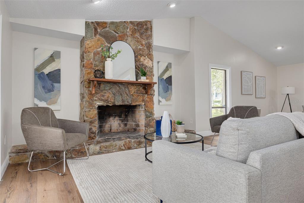 4415 Marine Parkway New Port Richey, FL 34652 - Photo 8 of 61 a living room with furniture and a fireplace