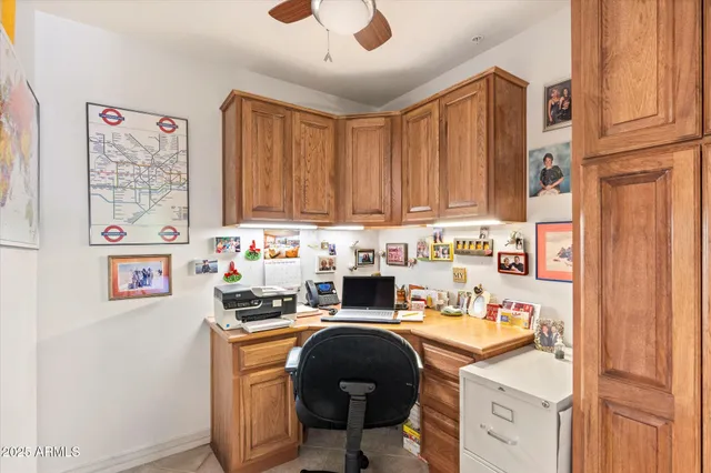 a living room with furniture a chandelier and a flat screen tv