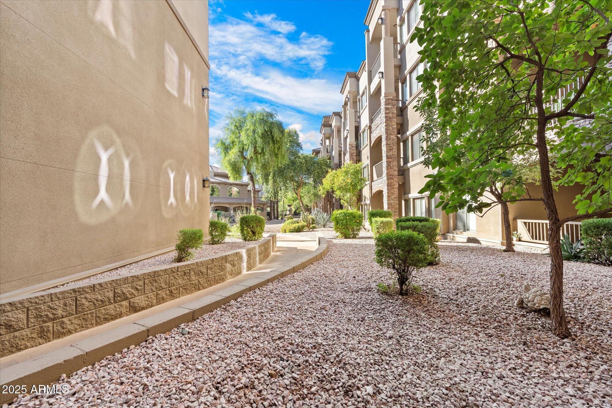 5350 East Deer Valley Drive, Unit 1238 Phoenix, AZ 85054 - Photo 21 of 29 a building with trees in front of it