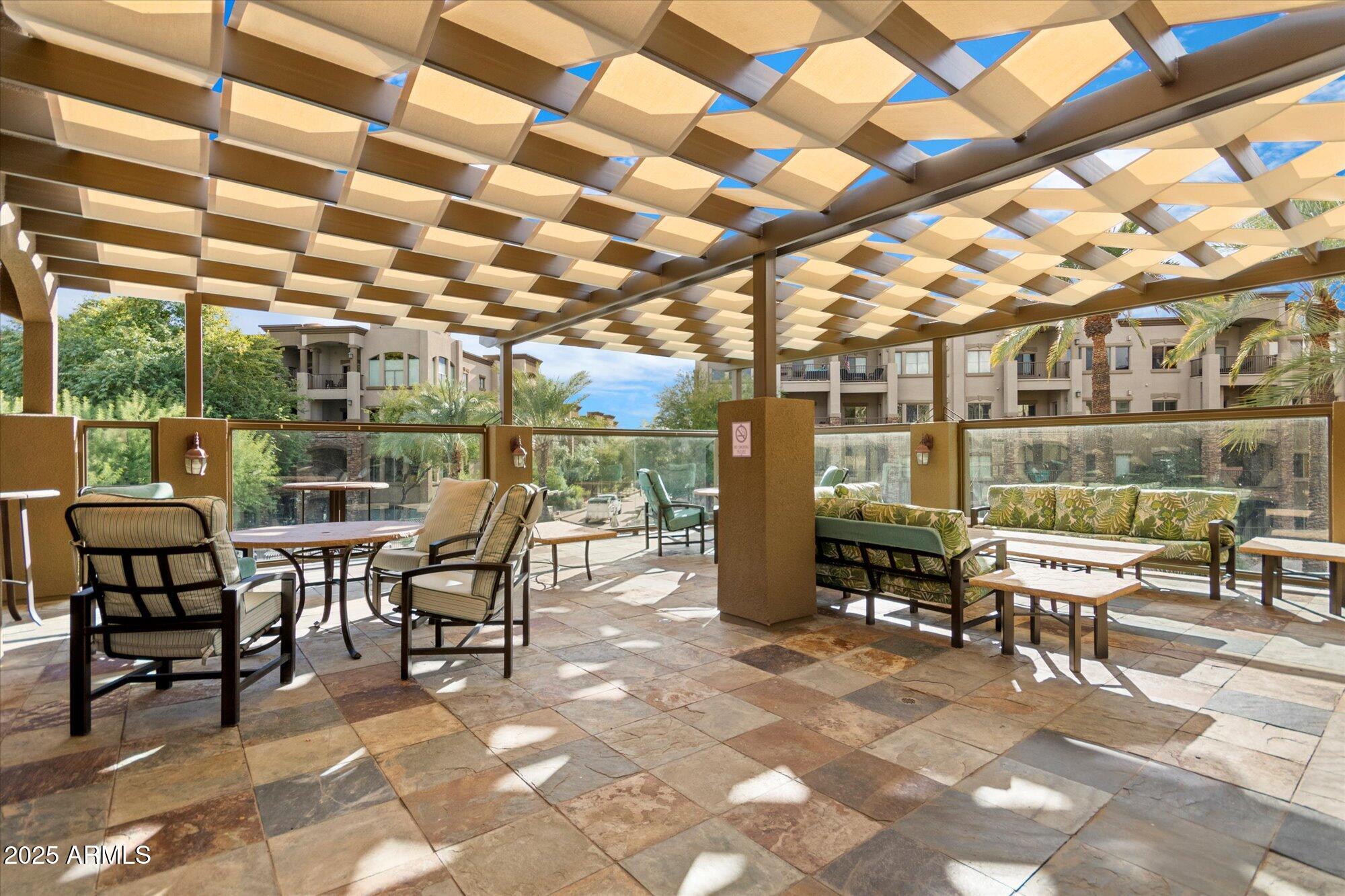 5350 East Deer Valley Drive, Unit 1238 Phoenix, AZ 85054 - Photo 24 of 29 a outdoor space with lots of chairs and mirrors