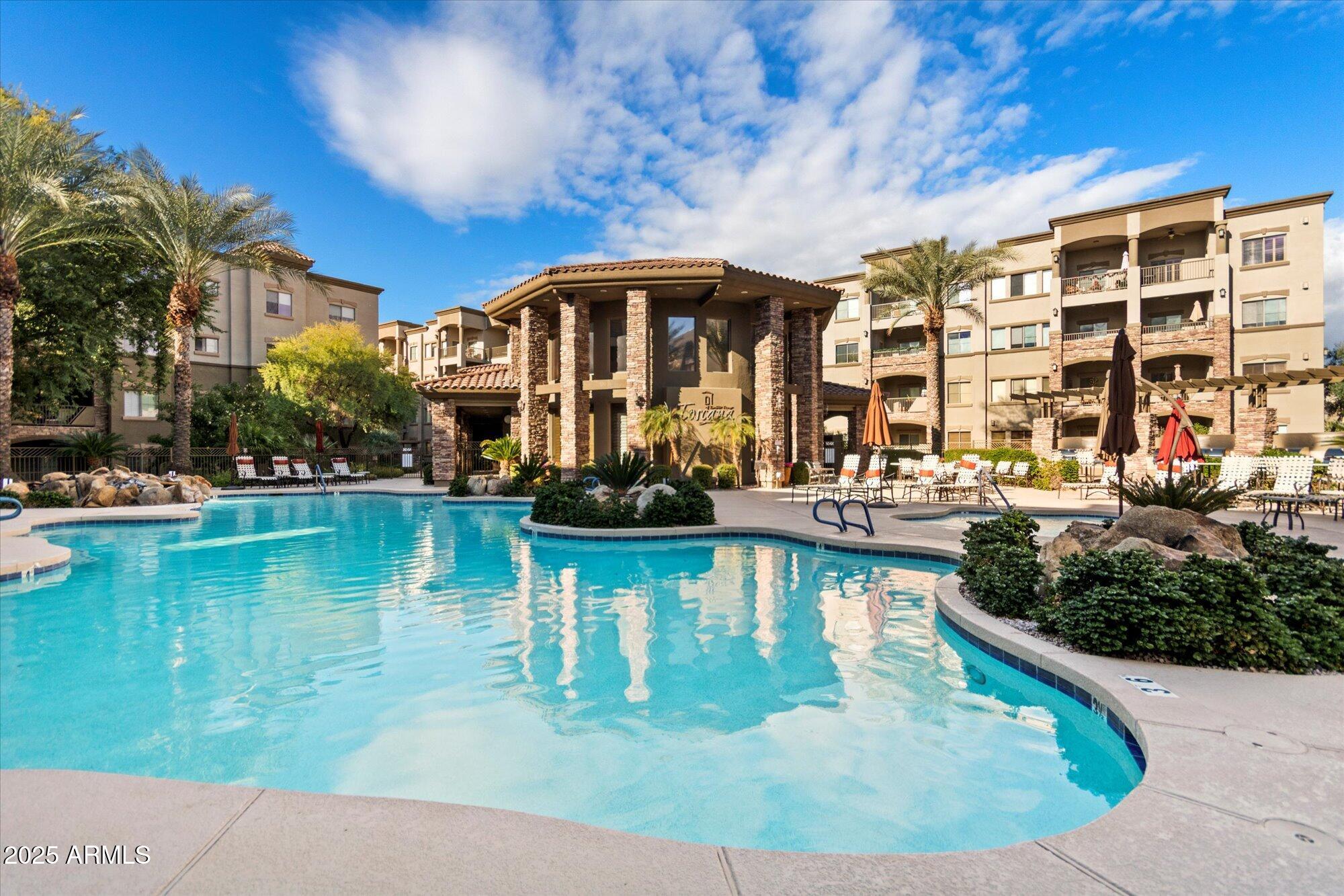 5350 East Deer Valley Drive, Unit 1238 Phoenix, AZ 85054 - Photo 26 of 29 a view of a swimming pool with a patio