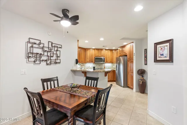 a living room with lots of furniture and a dining table