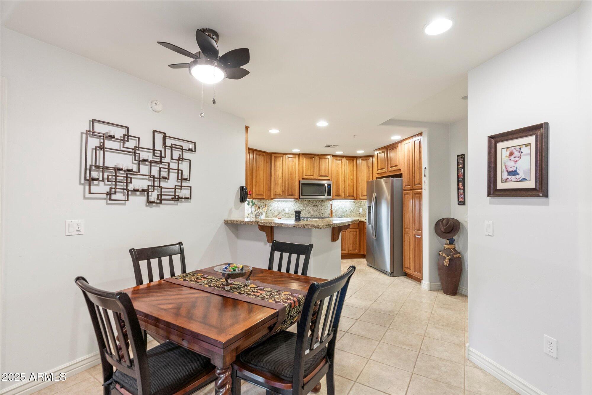 5350 East Deer Valley Drive, Unit 1238 Phoenix, AZ 85054 - Photo 5 of 29 a view of a dining room with furniture