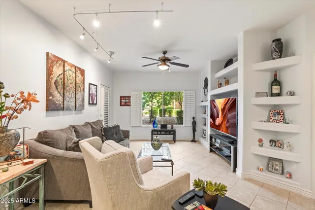 a living room with furniture a dining table and a fireplace
