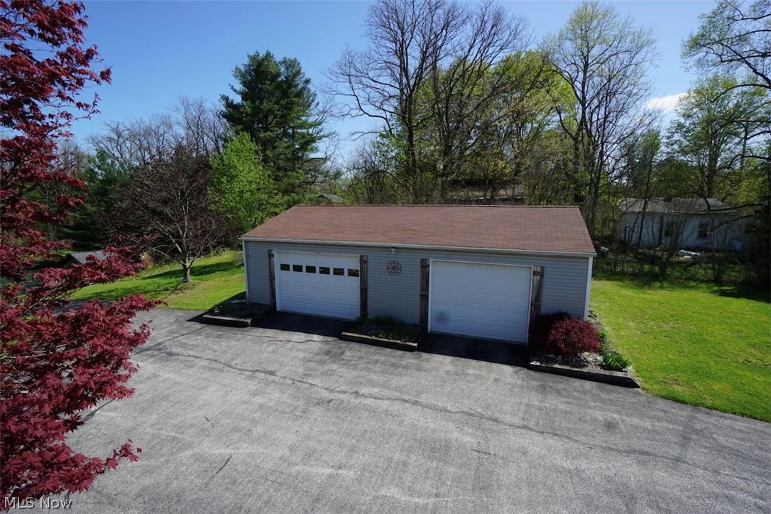 4173 South Ridge Road East Geneva, OH 44041 - Photo 27 of 42 Main garage with workshop