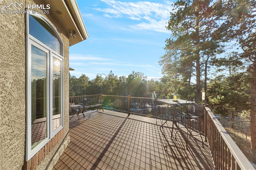 4450 Abert Ridge View Colorado Springs, CO 80908 - Photo 16 of 50 a view of a balcony with wooden floor