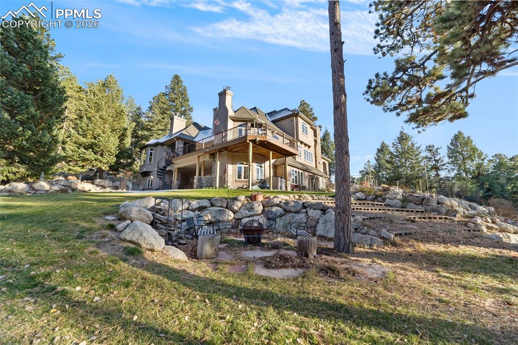 4450 Abert Ridge View Colorado Springs, CO 80908 - Photo 2 of 50 a view of a house with a yard