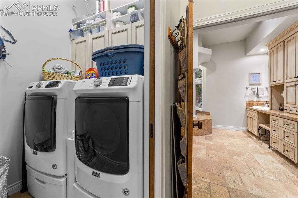 4450 Abert Ridge View Colorado Springs, CO 80908 - Photo 25 of 50 a utility room with dryer and washer