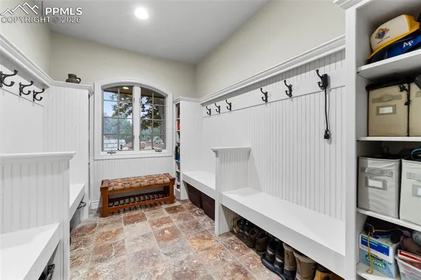 a bathroom with a toilet a sink and a mirror