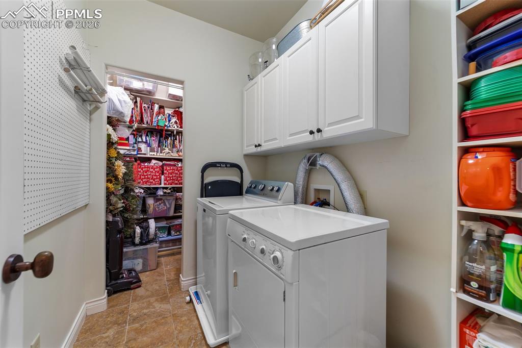 4450 Abert Ridge View Colorado Springs, CO 80908 - Photo 29 of 50 a utility room with dryer and washer
