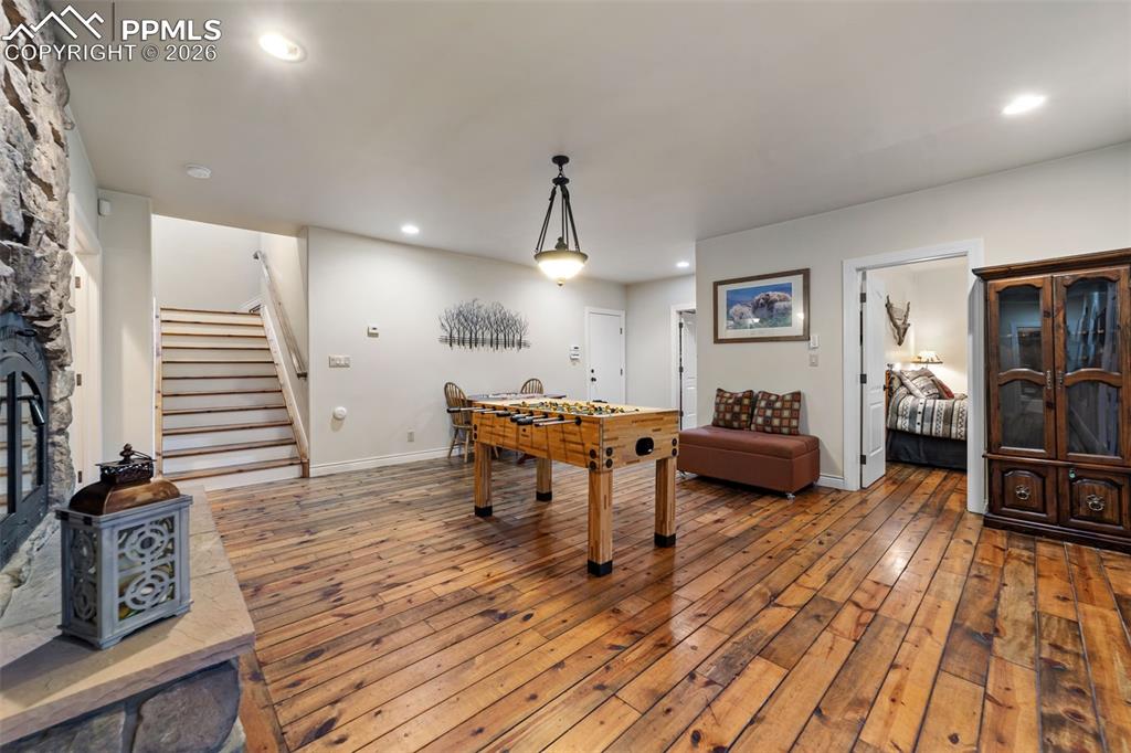 4450 Abert Ridge View Colorado Springs, CO 80908 - Photo 35 of 50 a living room with furniture and wooden floor