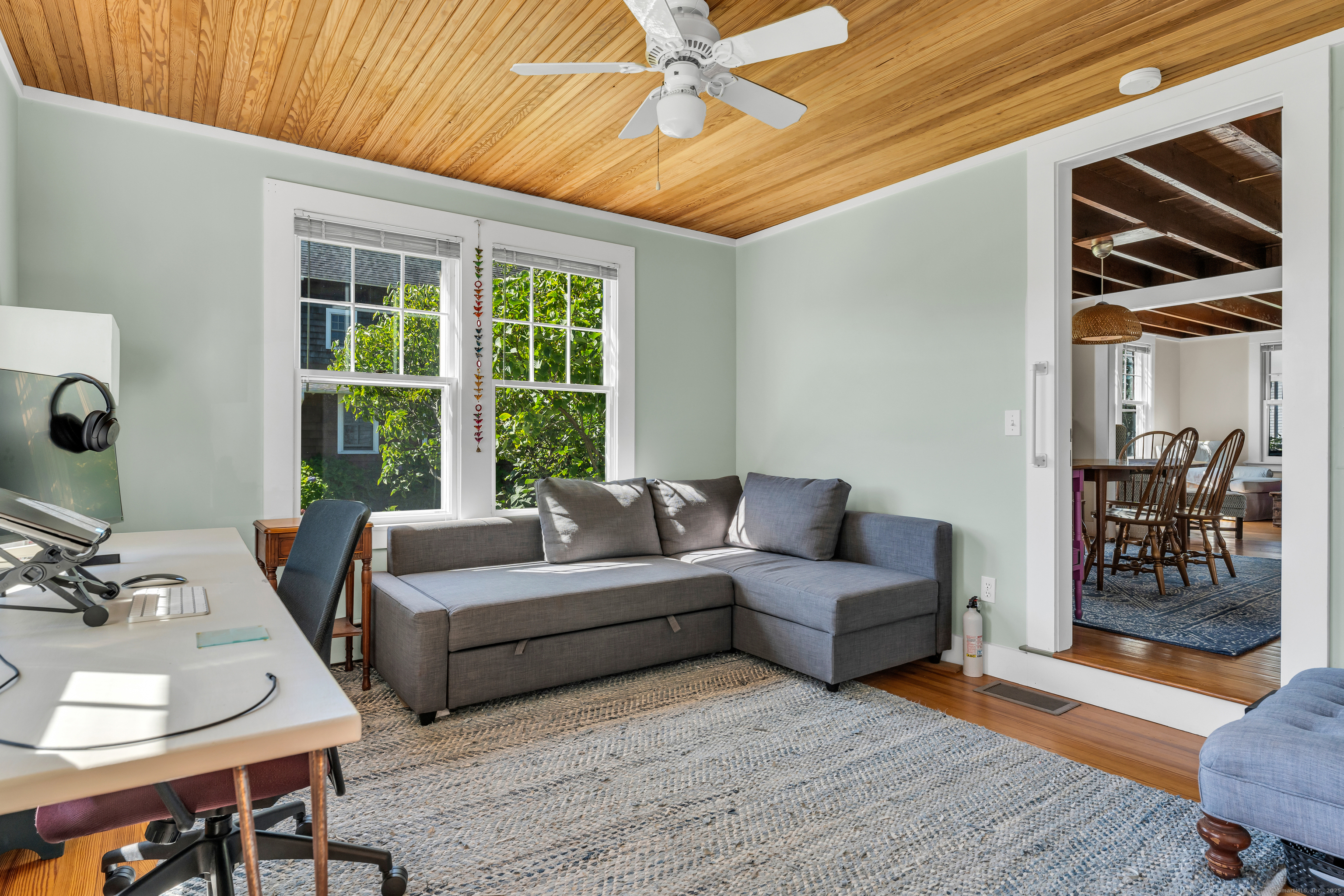 27 Ridgewood Avenue Madison, CT 06443 - Photo 11 of 31 The couch in the den folds out to a bed.