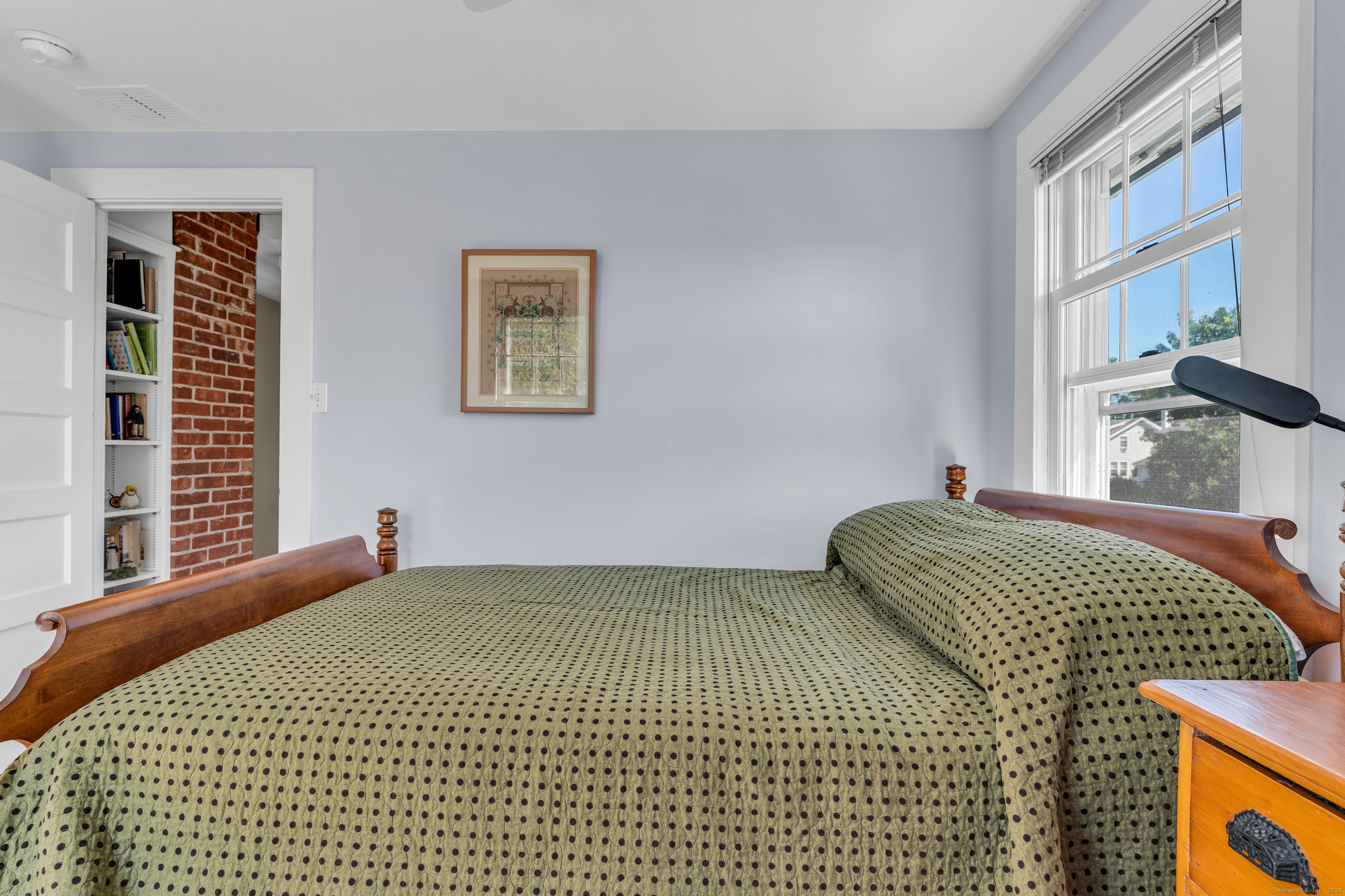 27 Ridgewood Avenue Madison, CT 06443 - Photo 14 of 31 a bedroom with a bed and a window