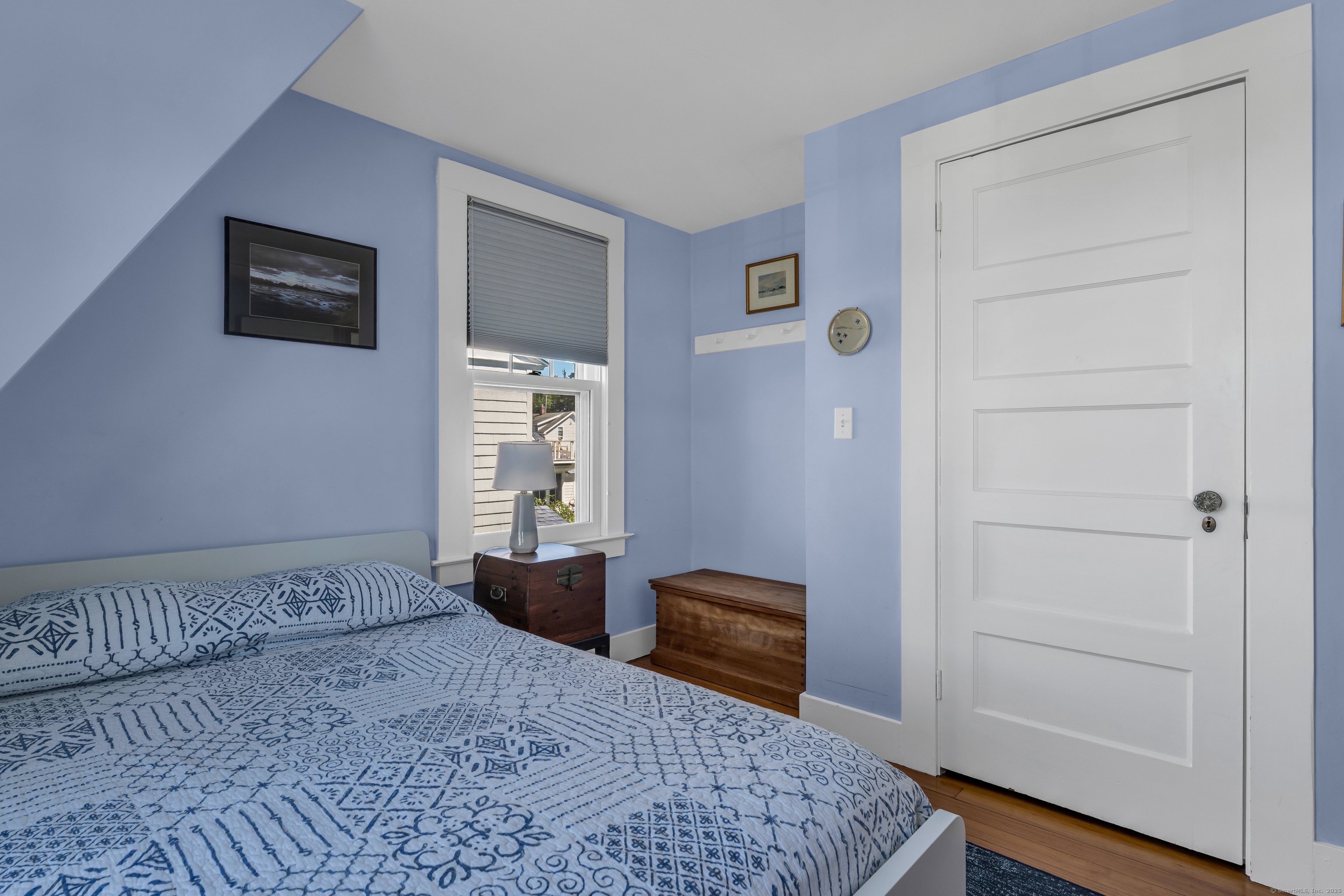 27 Ridgewood Avenue Madison, CT 06443 - Photo 16 of 31 a bedroom with a bed and a dresser