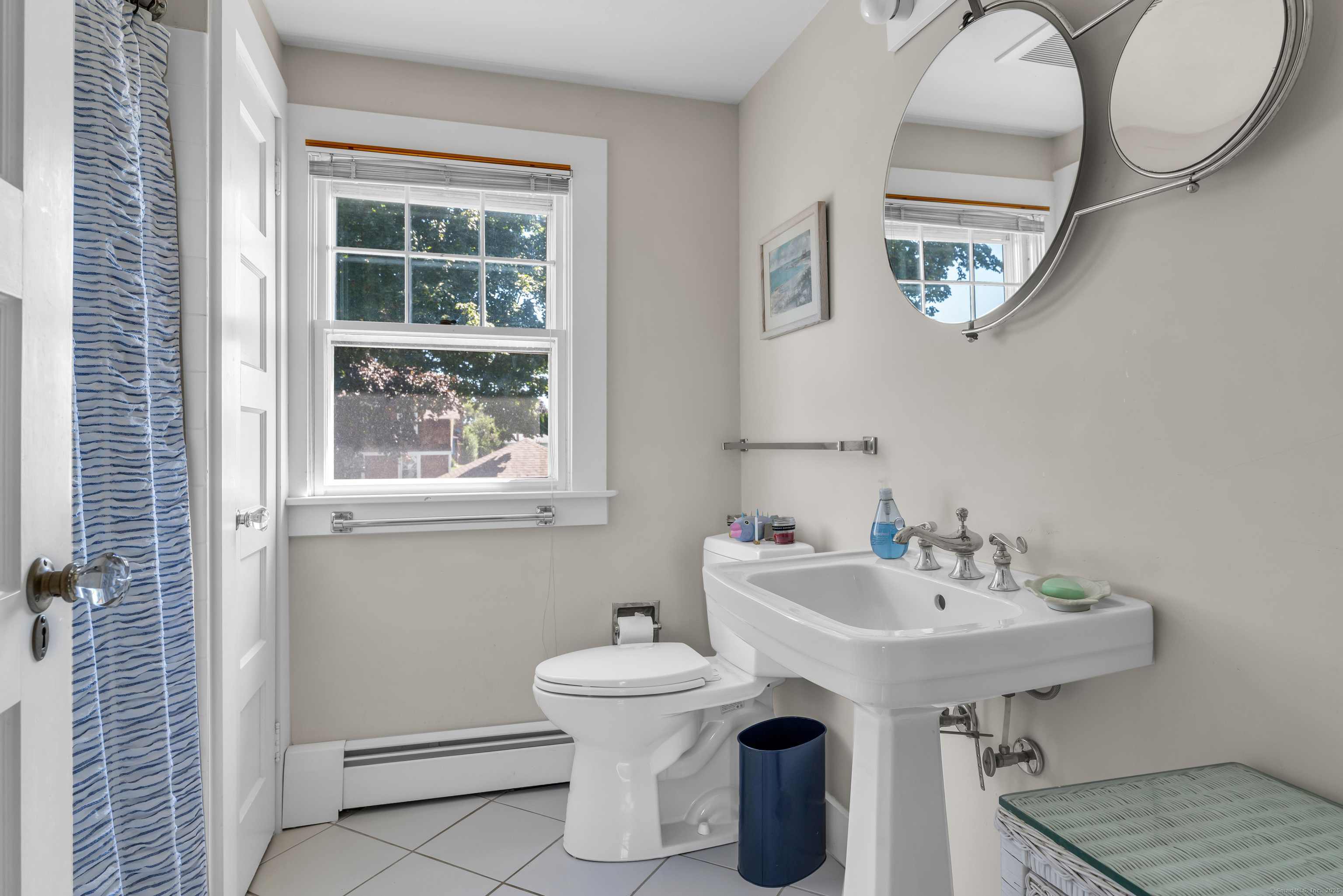 27 Ridgewood Avenue Madison, CT 06443 - Photo 17 of 31 a bathroom with a sink and a mirror