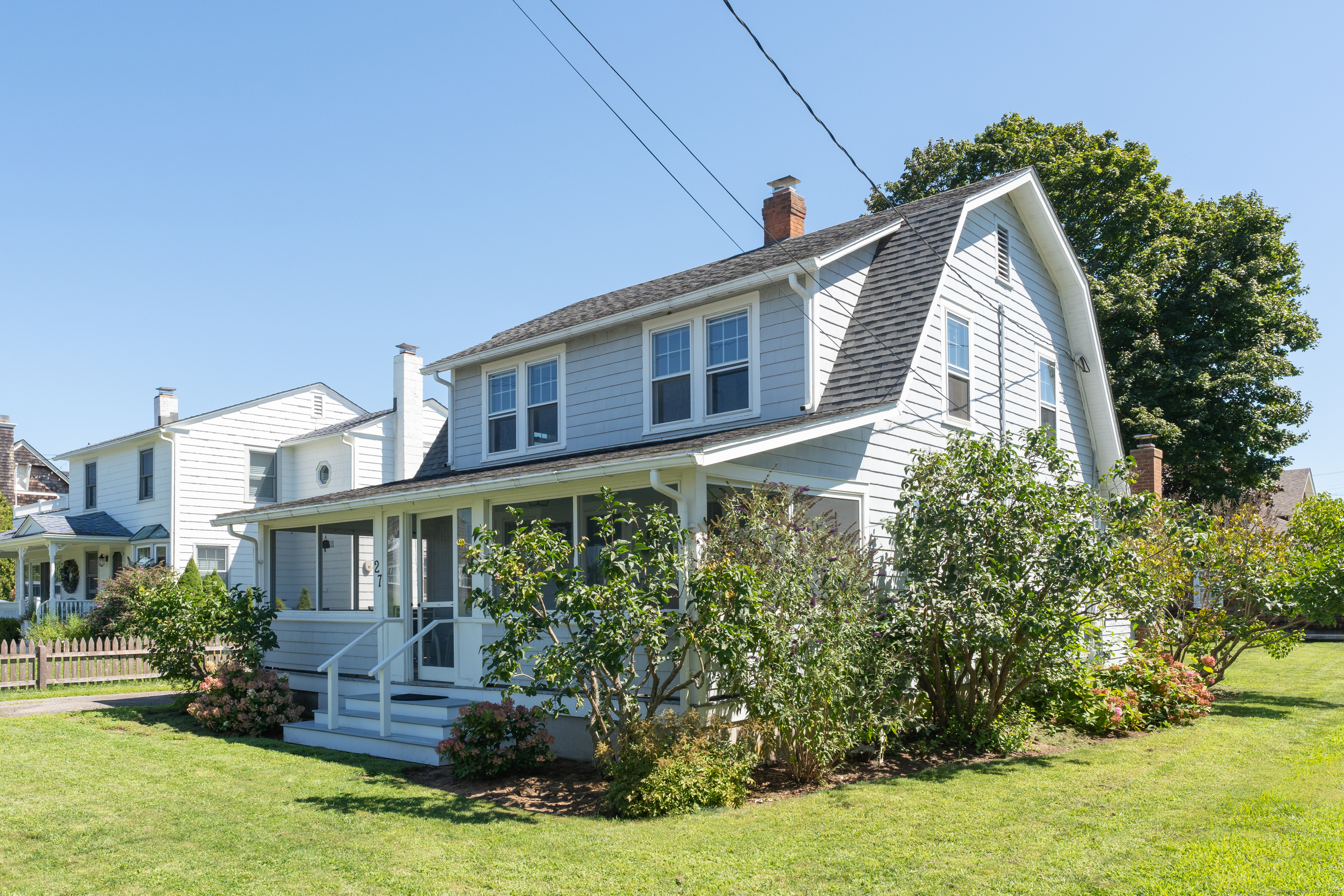 27 Ridgewood Avenue Madison, CT 06443 - Photo 19 of 31 a front view of a house with a yard