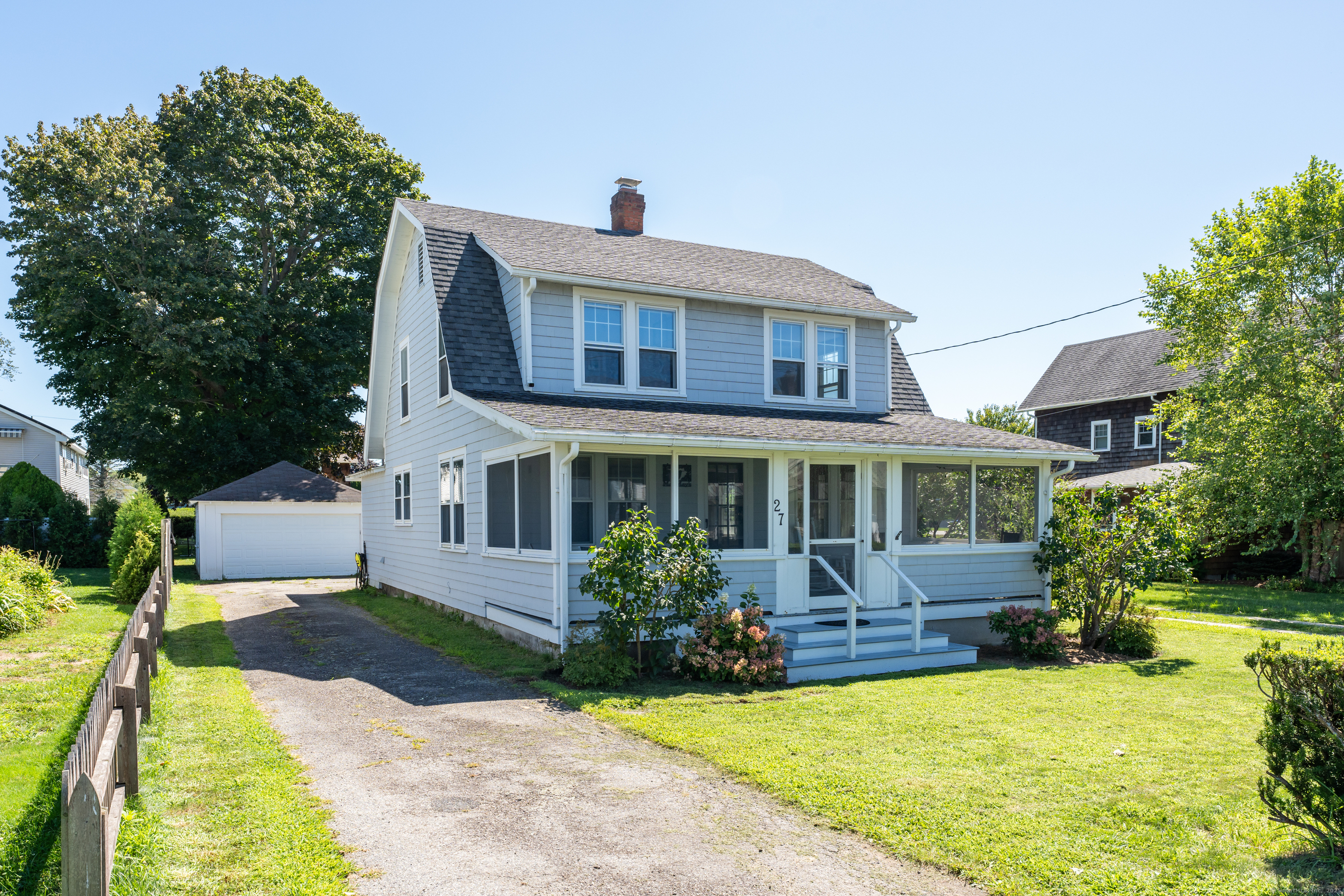27 Ridgewood Avenue Madison, CT 06443 - Photo 27 of 31 a front view of a house with yard and green space