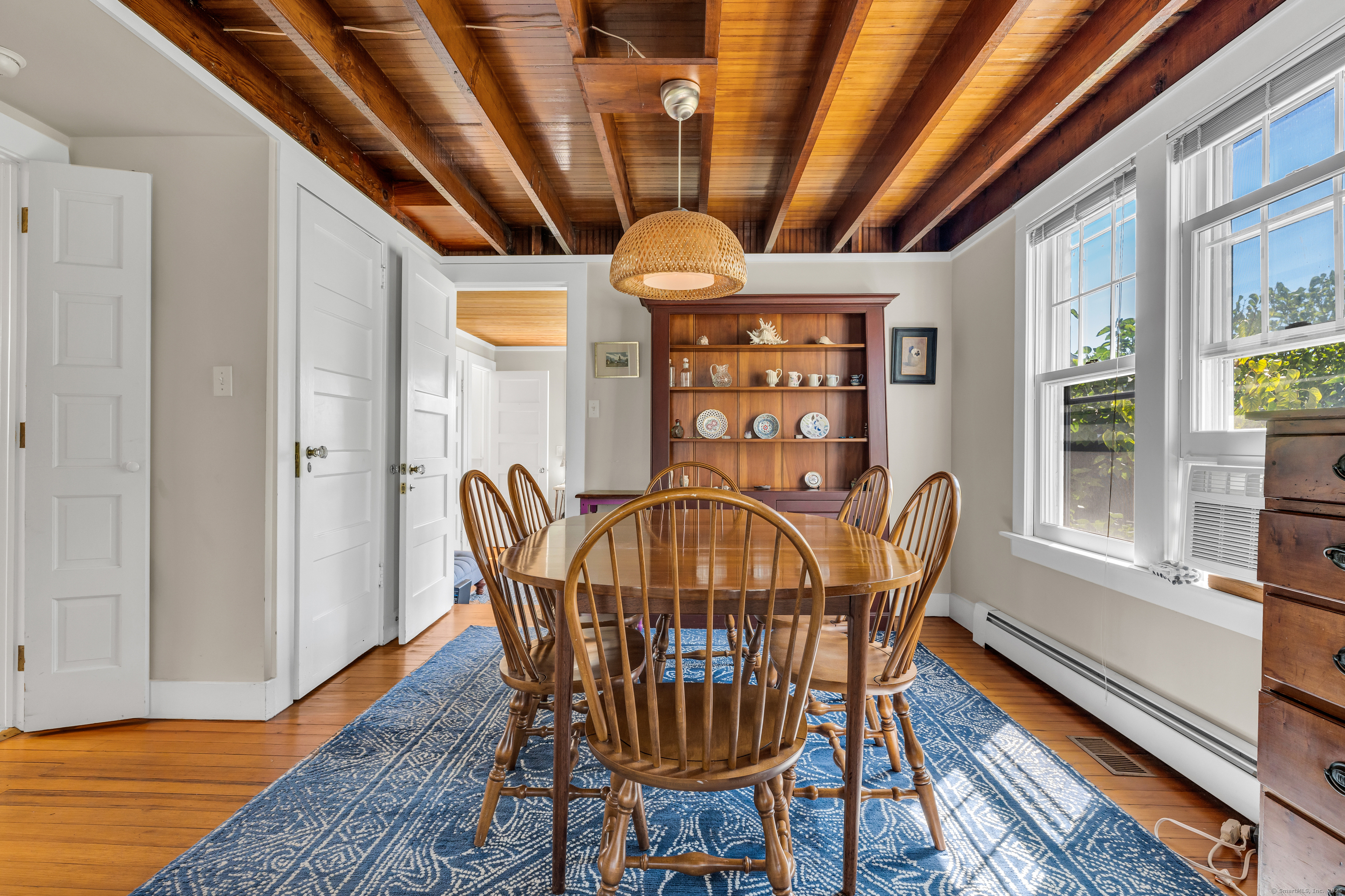 27 Ridgewood Avenue Madison, CT 06443 - Photo 3 of 31 a view of a dining room with furniture window and wooden floor