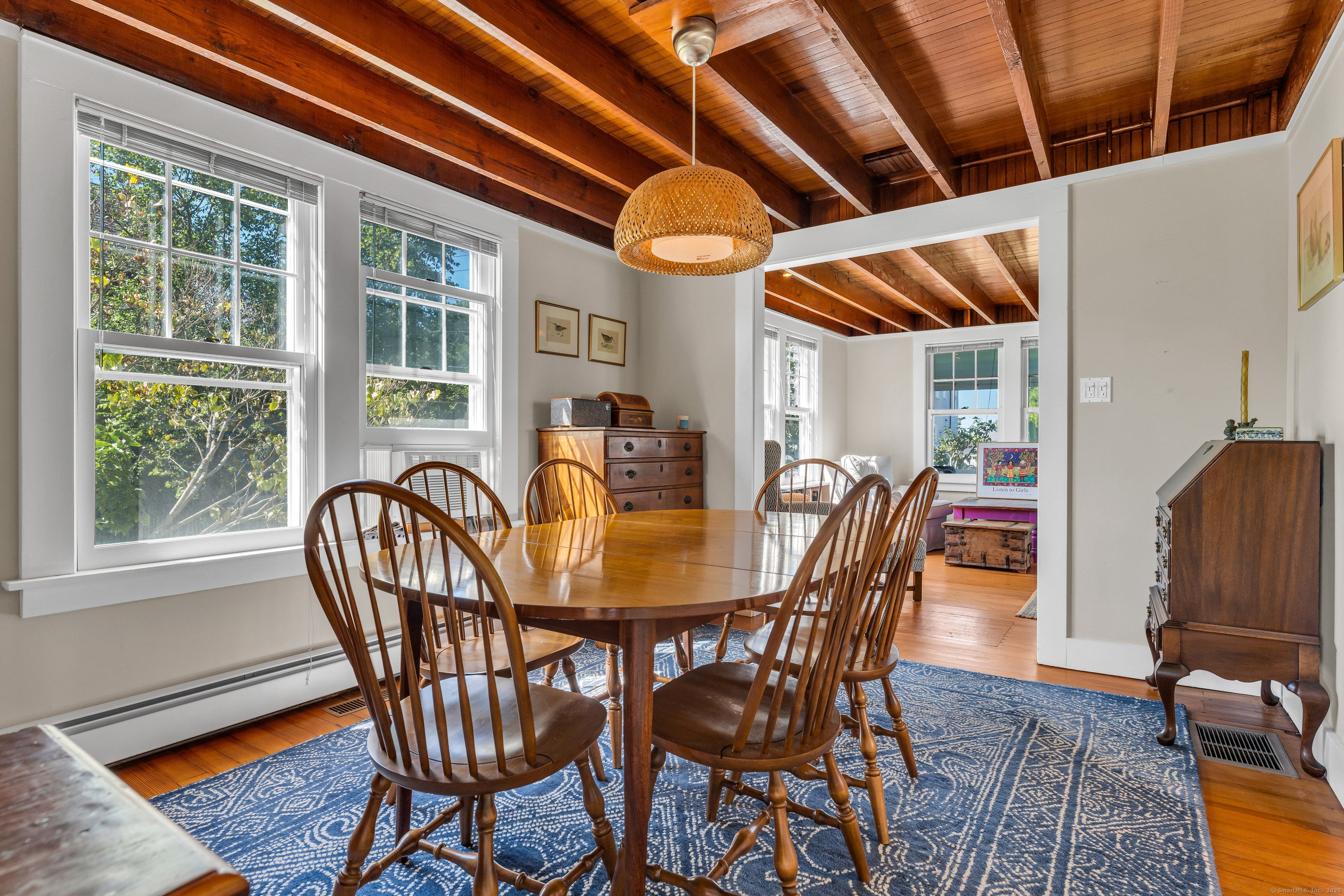 27 Ridgewood Avenue Madison, CT 06443 - Photo 4 of 31 a view of a dining room with furniture window and wooden floor